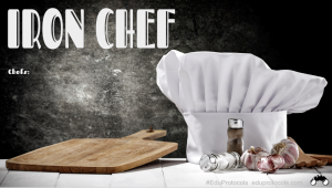 This is an image of a slide that reads, "Iron Chef" and has a picture of a chef hat, cutting board, and produce.