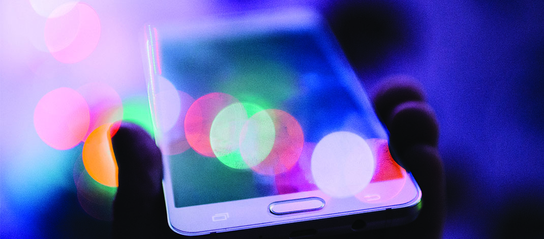 Image of a cell phone in someone's hand.