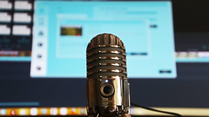 selective focus photography of gray stainless steel condenser microphone