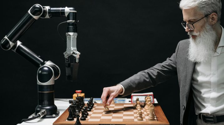 a bearded man playing chess
